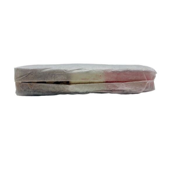 neapolitan freeze dried ice cream sandwich wrapped in wrapper showing the slit in paper that is there for production purposes